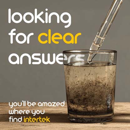 A glass of cloudy water being tested