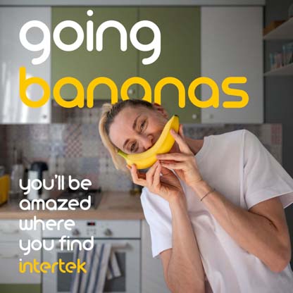 A woman fondly holding a banana next to her face