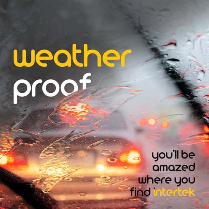 The back of a car viewed through a rain-soaked windscreen